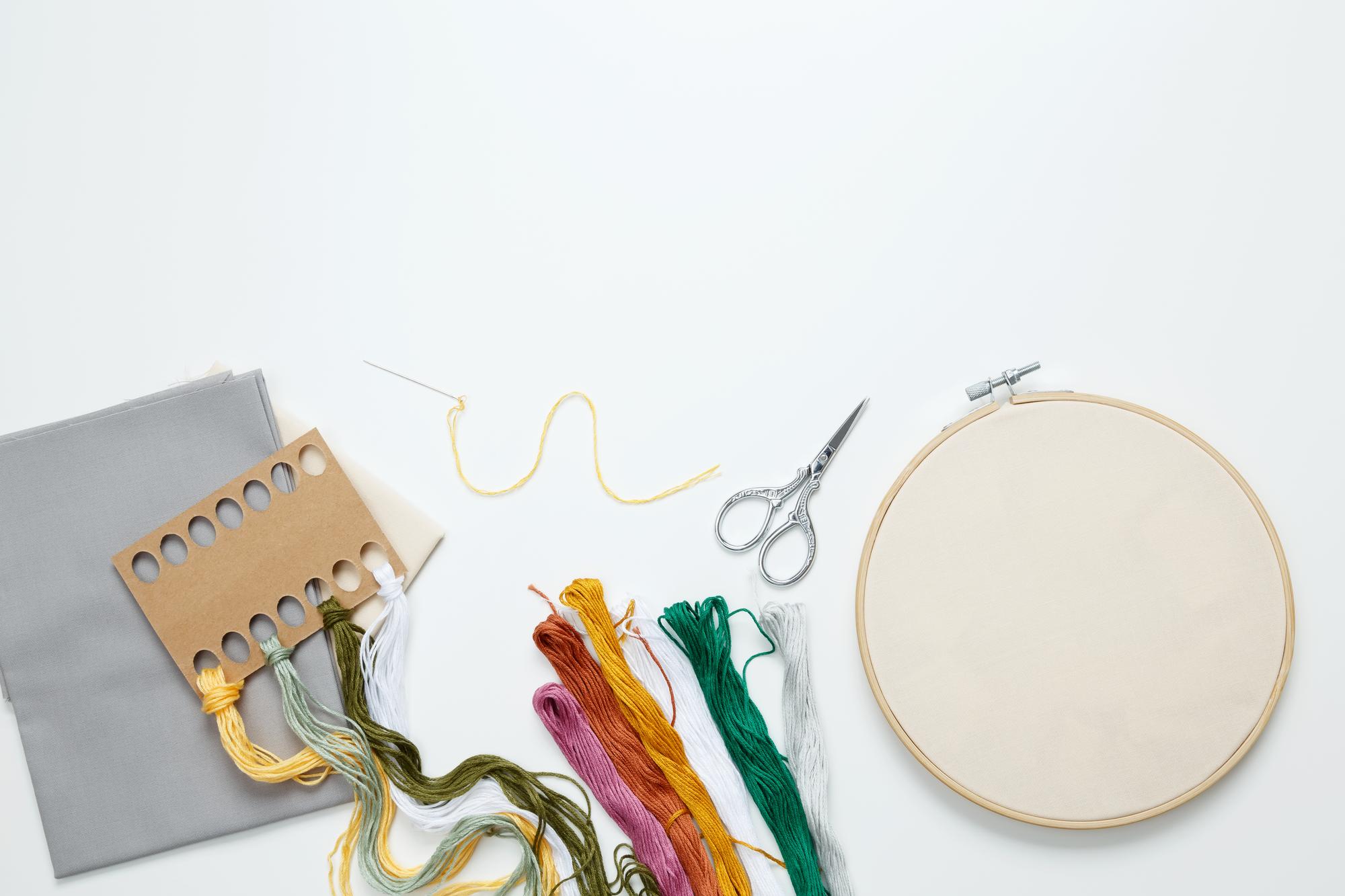 Workshop table with threads and embroidered patches