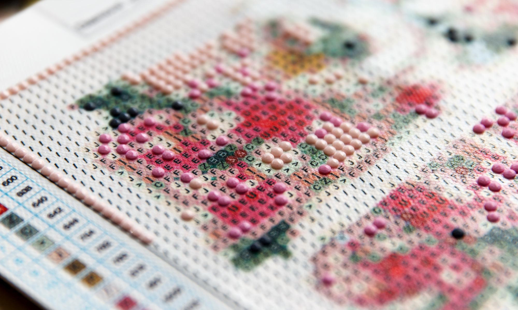 Selection of embroidered samples on table